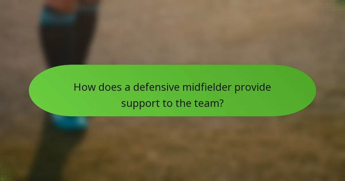 How does a defensive midfielder provide support to the team?
